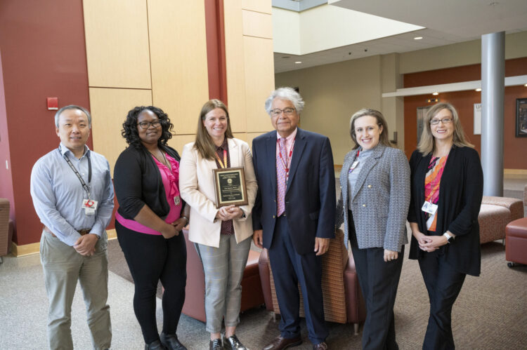 Faculty from the Department of Dietetics and Nutrition with Lisa Jansen and her award.